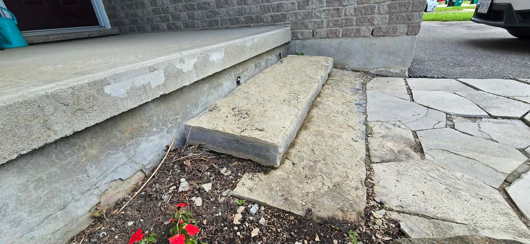 Close-up of the cracked, sinking step before repair